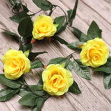 Yellow silk polyester artificial rose vine flowers with green leaves, ideal for home party garden wall decoration