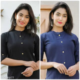 The image depicts a woman wearing a blue kurta, standing in front of a building with a wooden door. She has dark hair and is smiling at the camera