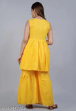 Yellow Bhandej suit, featuring a matching kurta and pants set with flared bottoms