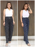 White and navy blue patterned women's pajama pants with a V-neck top