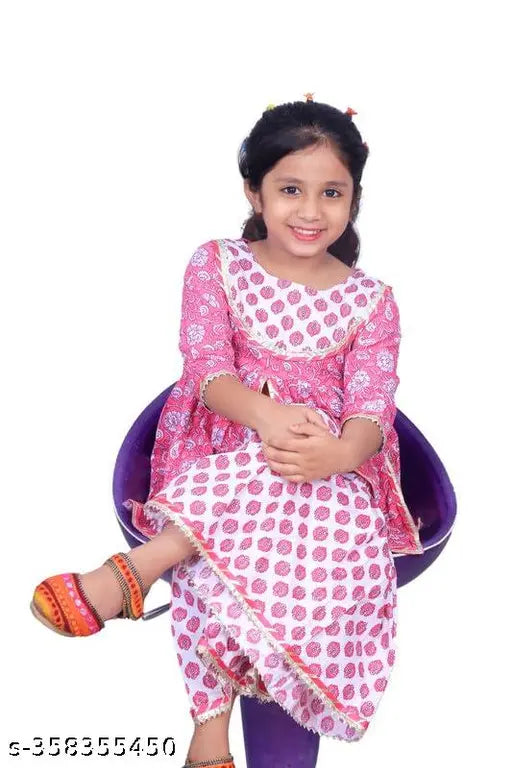 Pink rayon kurti sharara set for baby girls, traditional Indian outfit on display