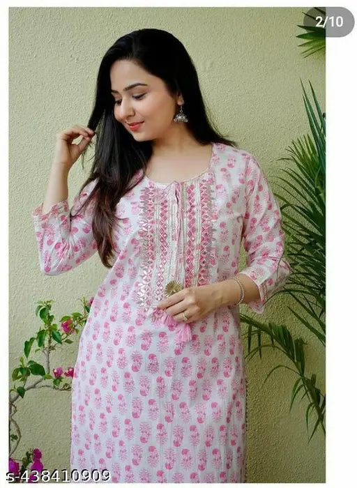 Pink rayon kurta set with palazzos, intricately detailed neckline, matching printed bottomwear, ethnic Indian fashion on display stand