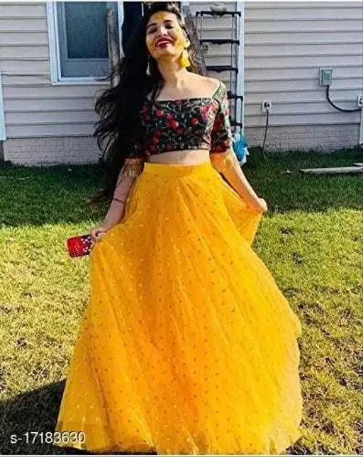 Yellow satin and net semi-stitched lehenga choli with embroidered patterns and lace dupatta, attractive new design for traditional Indian wear