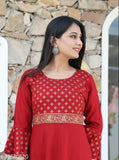 Red printed kurti with embellished borders and decorative elements