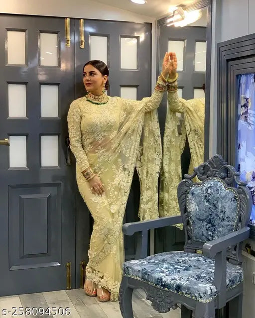 Cream net Bollywood designer party wear saree with embroidered blouse piece, free size, India origin