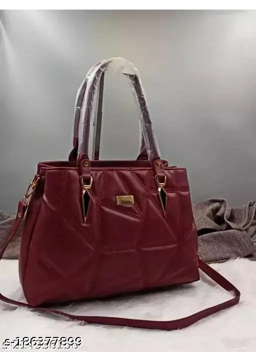 Red faux leather shoulder bag with a long handle
