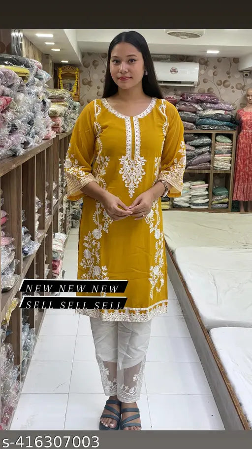 Georgette Pakistani kurta pair with embroidered net, three-quarter sleeves and crepe bottom pants. Available in S-XXXL for home wash or machine wash." (124 characters)