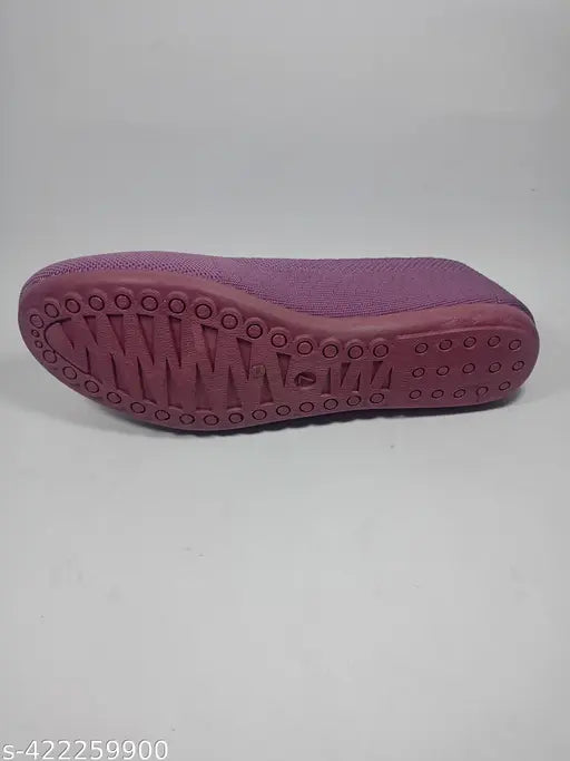 Purple foam clog with textured sole, lightweight and flexible.