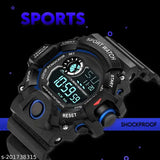 Black digital watch with blue illuminated screen, water resistance rating, military green strap
