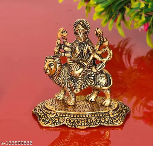 Hand-carved metal statue of Maa Durga, Maa Shakti, with a lion and showpiece quality. Small idol for Navratri home decor, golden color, 45cm height. Sculpture, intricate details, craftsmanship