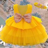 Yellow ruffled tulle baby girl dress with pink bow