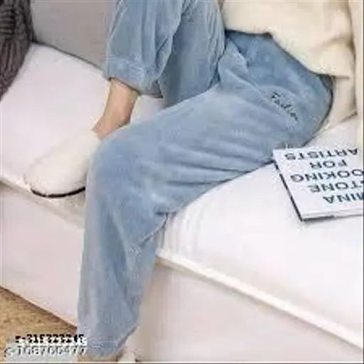 A cozy women's woolen stretchy nightwear set for warmth in winter, featuring a comfy long sleeve top and pants with multiple colors and prints