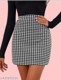 Women's houndstooth pattern skirt with black top