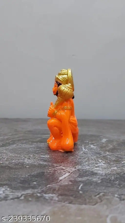 Gold metal idol of Hanuman, religious murti for car dashboard or home decor, spiritual puja gift item