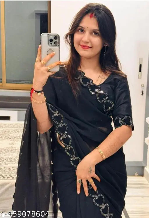 Black saree with traditional borders, woman posing for selfie