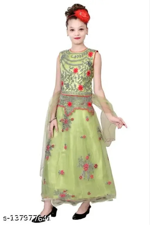 Green and gold floral patterned dress with long sleeves, standing against a plain white background