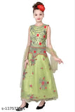 Green and gold floral patterned dress with long sleeves, standing against a plain white background