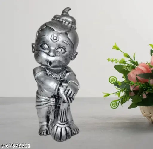 Black metal figurine of childlike deity, resembling Hindu mythological character, intricately designed idol, modern decoration, mother's day gift, vastu and positive energy, trending 2024, vastu object