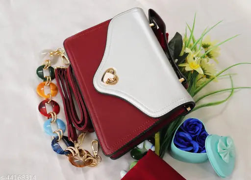 Spacious two-partition sling bag in synthetic leather with a maroon and white pattern