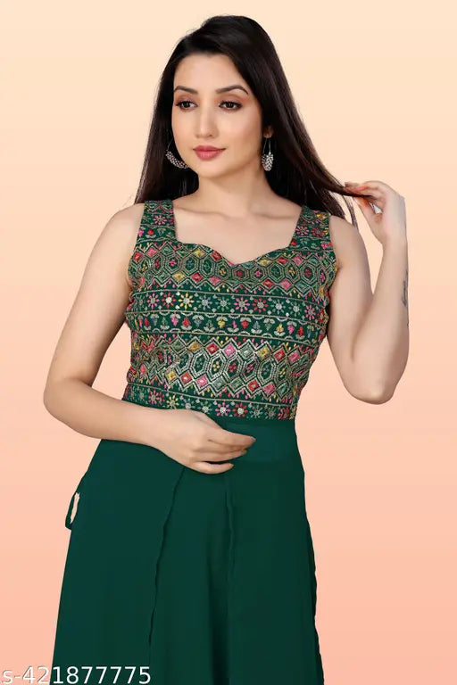A dark green sari with a matching blouse and a Gujarati design