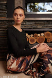 Women's midi skirt in black, white and gold print on pleated maxi length fabric