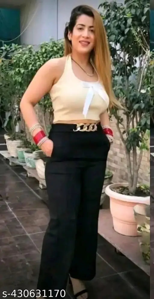 Ravishing bell-bottom pants in black with golden trim, women's style