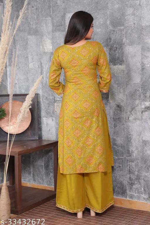 Fancy rayon kurta set with palazzos, three-quarter sleeves, embroidered net design. Single size for women, handcrafted in India
