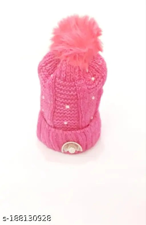 Pink knitted hat with pompom on top
