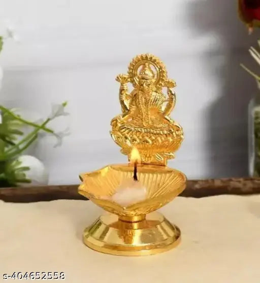 Golden brass diya set for Indian home decor, featuring Maa Laxmi Kuber lamp with intricate details