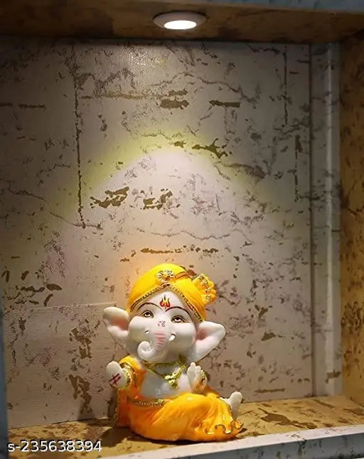Yellow poly marble mini Ganesha statue for car dashboard, intricately crafted Hindu God of Success idol