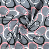 Gray geometric-patterned Amrange Cotton Feel Glace fitted King size bedsheet with 2 pillow covers, ideal for summer use on mattresses 4-8 inches high and 6x6.5 ft long. Breathable, wrinkle-free, lightweight, easy to wash at home. SuperSoft premium brushed polycotton material. Elastic trim ensures a neat finish and firm fit