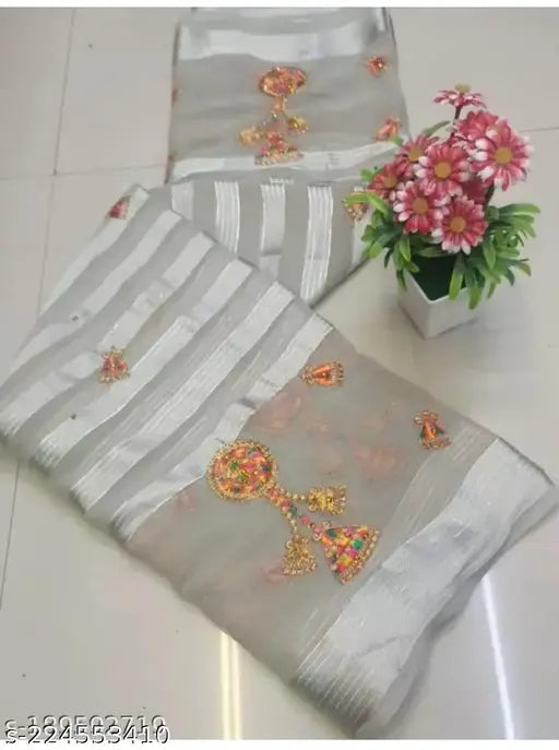 Gold chiffon saree with zari woven net and multi embroidery, India