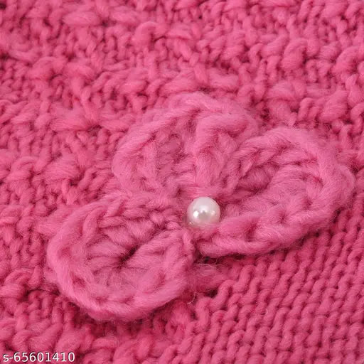 Stylish knitted round woolen hat with flower decoration, adorned with a pearl button inside, designed in India. Unisex fashion accessory for winter