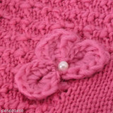 Stylish knitted round woolen hat with flower decoration, adorned with a pearl button inside, designed in India. Unisex fashion accessory for winter