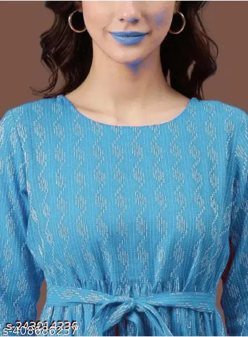 A blue and white kurta on a woman, patterned design