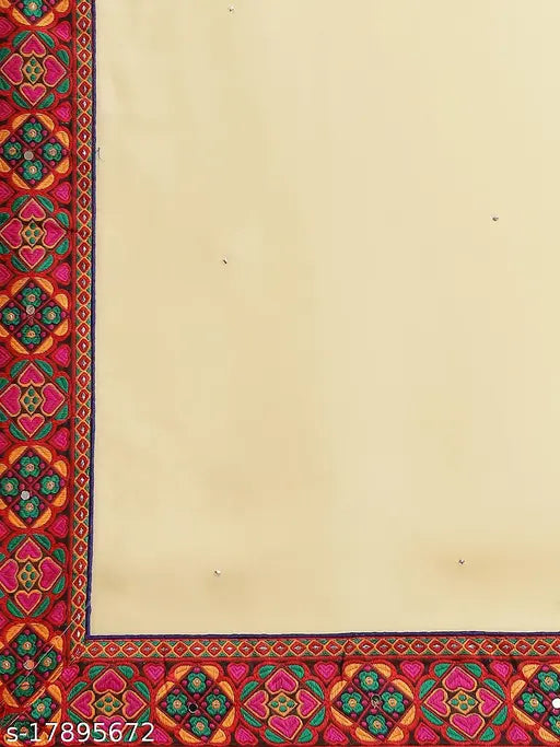 Women's sari with intricate Kutchi embroidery on a dark background, likely cotton or silk fabric
