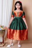 Green and gold children's dress with pattu design