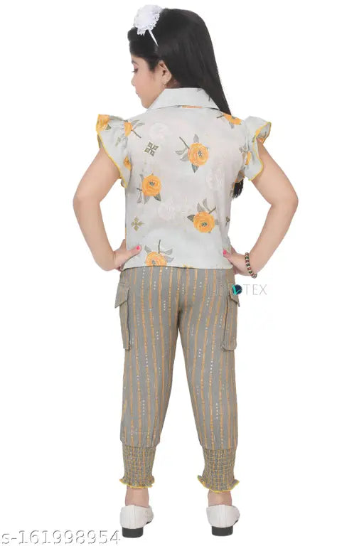 Yellow patterned blouse, denim jeans style pants