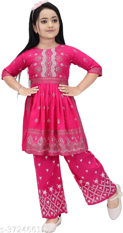 Embellished Viscose Rayon A-line Kurta with three-quarter sleeves and palazzo set in intricate print. Crafted for comfort and style for girls aged 5-12 years. Indian fashion for contemporary occasions