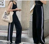 Black cropped sweatpants with white stripes