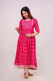 Pink cotton blend Anarkali-style maternity kurti with tassels, featuring a print combo and three-quarter sleeves. Ideal for casual events, pairs well with leggings or palazzo pants. Indian origin. (120 characters)