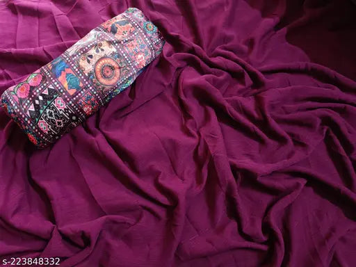 Purple saree with vibrant floral pattern on pink fabric