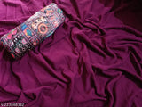 Purple saree with vibrant floral pattern on pink fabric