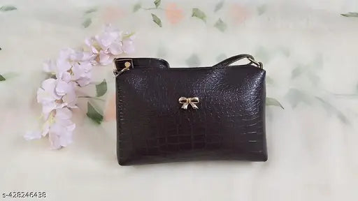Brown faux leather handbag by Akshita Creation, featuring adjustable crossbody straps and spacious main compartment. Women's designer bag for travel or daily use. Made in India