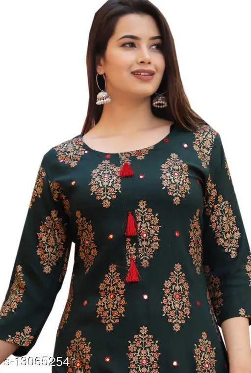 Green kurta, red sharara set with pom poms