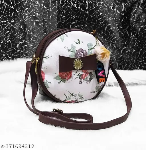 Round lavish fabric bag with floral print and brown trim