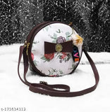 Round lavish fabric bag with floral print and brown trim