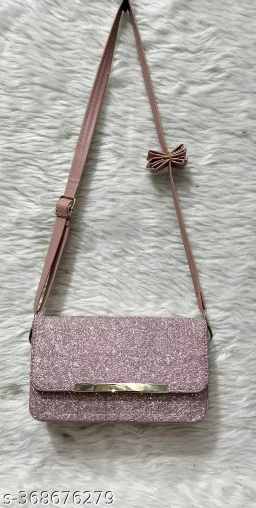 Ladies sling bag with bow accents, maroon background