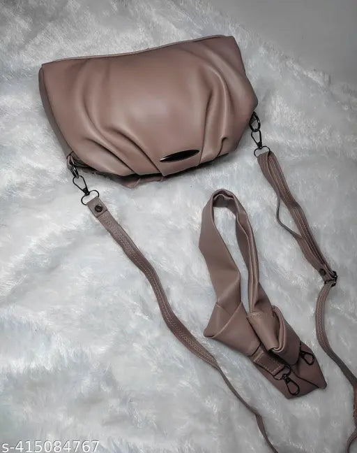 Light brown leather sling bag with shoulder strap