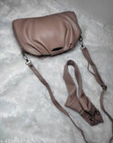 Light brown leather sling bag with shoulder strap